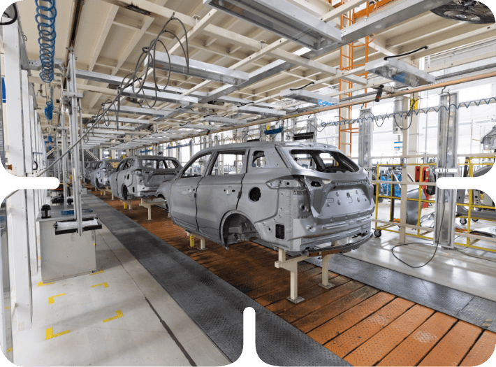 Automobile manufacturing assembly line with unfinished car bodies in a modern factory